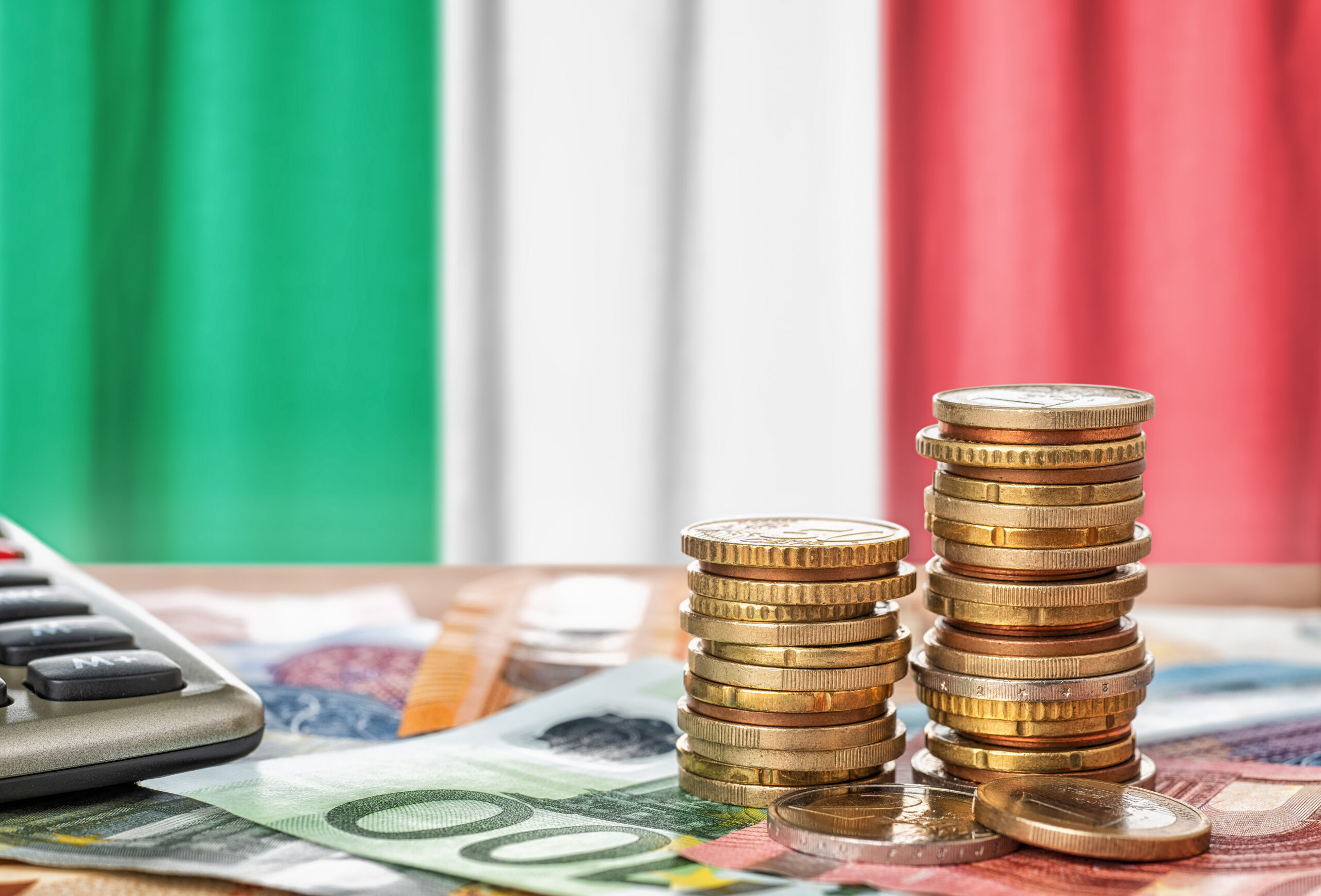 Euro,Banknotes,And,Coins,In,Front,Of,The,National,Flag